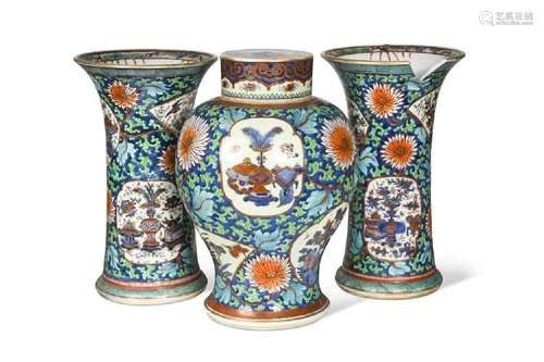 A Chinese blue and white porcelain clobbered garniture, Qing...