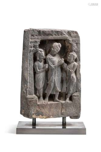 A Gandharan grey schist Buddha and two disciples temple pane...