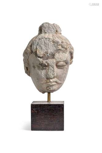 A Gandharan grey schist head of Buddha, 3rd/4th century,