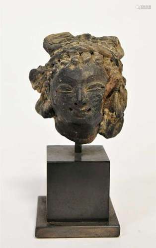 A Greco-Gandharan small black painted terracotta head of a M...