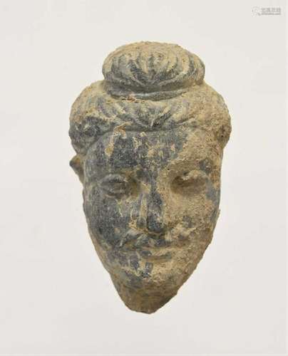 A Gandharan small grey schist head of Buddha, North India/Pa...