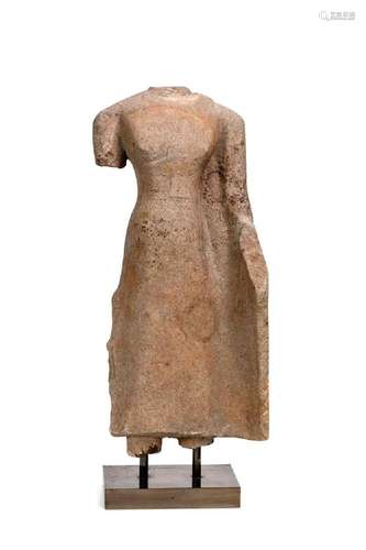 A Khmer sandstone standing female torso, perhaps 11th/12th c...