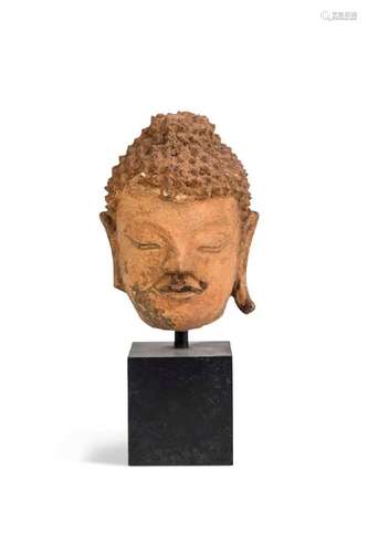 A Thai small stucco head of Buddha, perhaps Sukothai, 13th c...