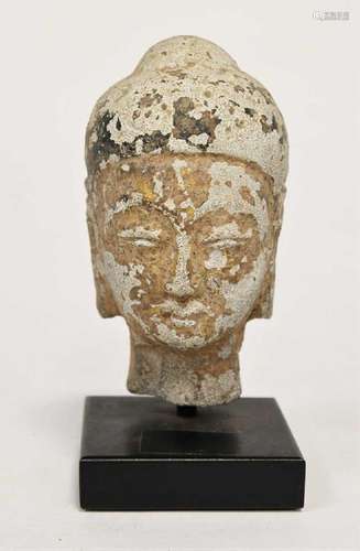 A Thai gilded and lacquered small stone head of Buddha, perh...