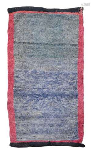 A provincial Tibetan wool rug, circa 1910-20,