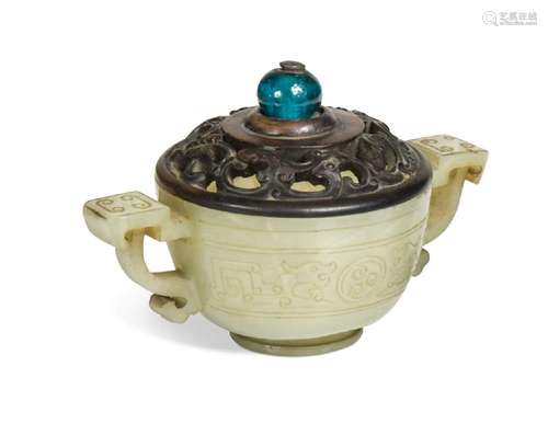 A Chinese jadeite twin handled small archaic cup, late Qing ...