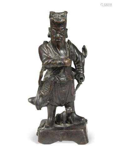 A Chinese bronze small figure of an Official, late Ming Dyna...