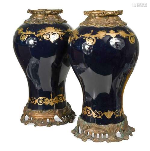 A large pair of gilt metal mounted Continental porcelain vas...