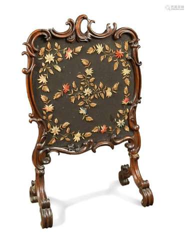 A mid-Victorian walnut fire screen,