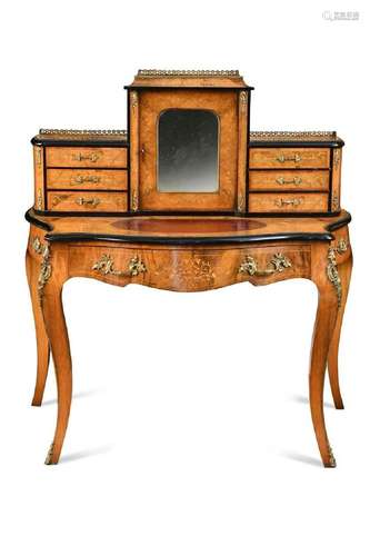 A gilt mounted walnut and ebonised serpentine writing desk, ...