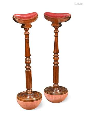 A late Victorian pair of mahogany drunken crutches,