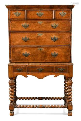 A walnut chest on later stand, 18th century,