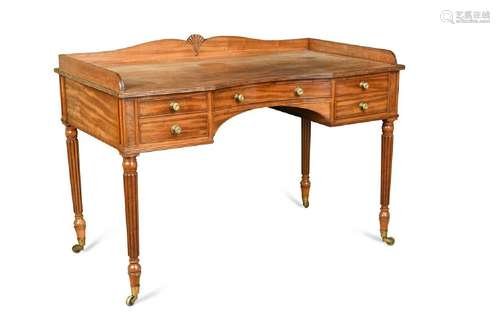 A mahogany gentlemans writing table in the style of Gillows,...