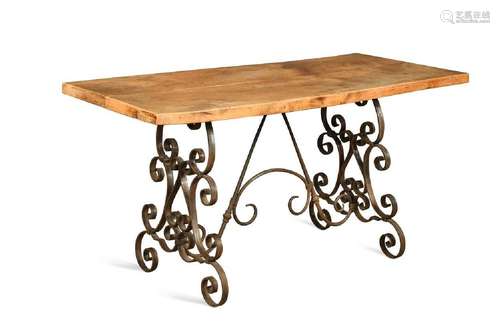 A provincial fruitwood and iron work table, 20th century,