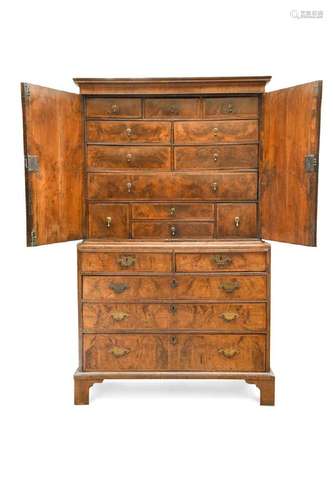 A George I walnut and feather banded cabinet on chest,