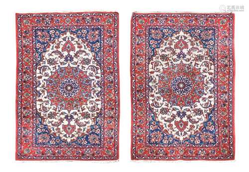 A pair of finely-woven Kerman rugs, circa 1930,