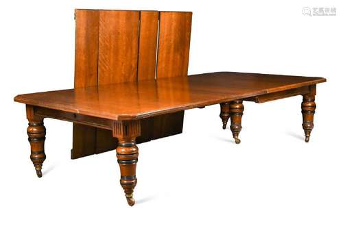 A late Victorian walnut and ebonised extending dining table,