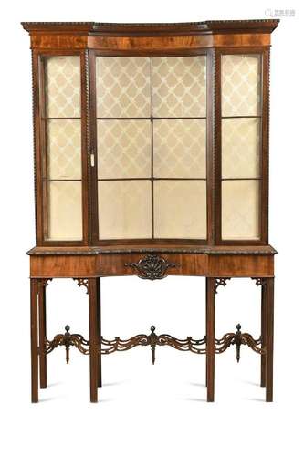 A mahogany display cabinet with concave central door, early ...