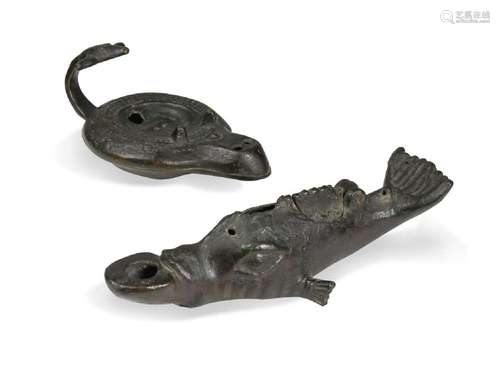 A bronze oil lamp in the form of a dolphin, probably Pompeia...