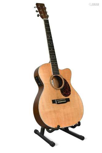 A Martin & Co. OMC-16OGTE acoustic six-string guitar,