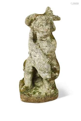 A composite stone figure of a putto with fish, early 20th ce...