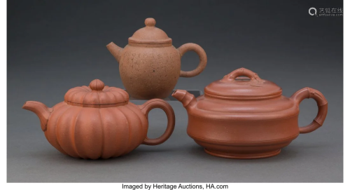 A Group of Three Chinese Yixing Pottery Teapots