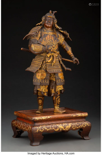 A Japanese Bronze Okimono of a Samurai on a Wood