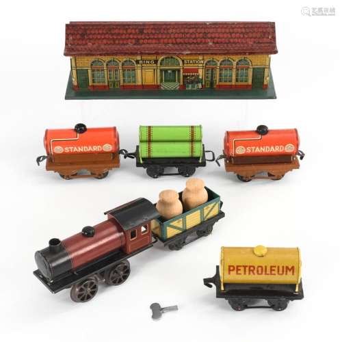 BING STATION AND TIN LOCOMOTIVE WITH 5 CARS. 0 GAUGE.