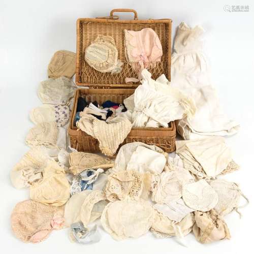 CONVOLUTE BABY LINEN AND OLD HOODS IN BASKET CASE.