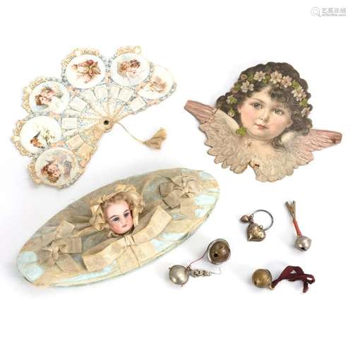 OVAL BOX WITH DOLL HEAD, FAN, EMBOSSED ANGEL HEAD AND 5 RATT...