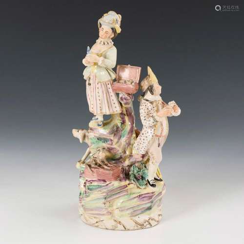 BAROQUE FAIENCE FIGURAL GROUP WITH DOG AND MONKEY.