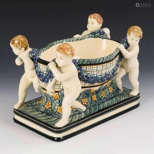 JARDINIÈRE WITH 4 PUTTI. KARLSRUHE MAJOLICA.