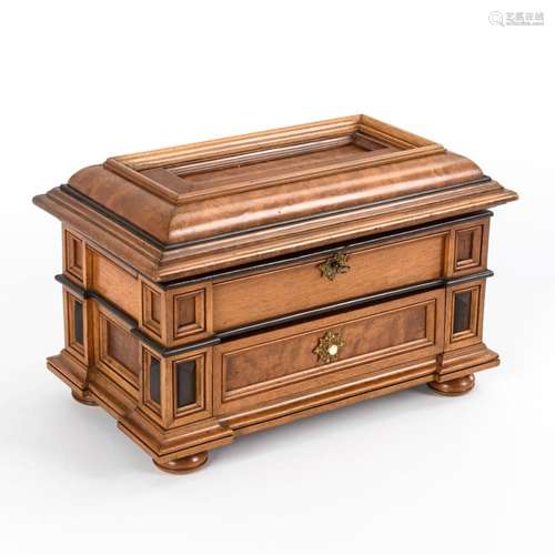 ELABORATELY CRAFTED CASKET.