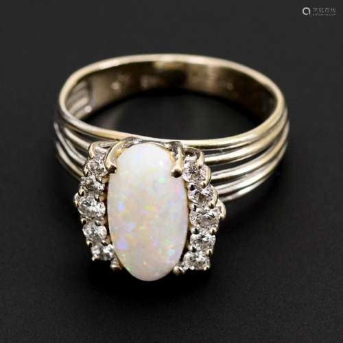 RING WITH WHITE OPAL AND DIAMONDS.