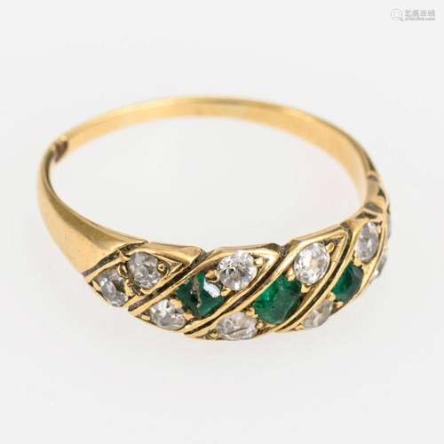 RING WITH EMERALDS AND OLD CUT DIAMONDS AROUND 1900.