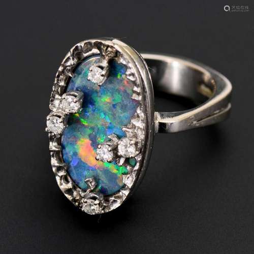 HEAVY RING WITH OPAL TRIPLET AND DIAMONDS.