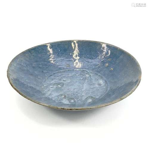 A Chinese Swatow blue glazed dish, late Ming Dynasty, 16th/e...