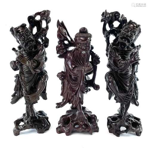 A pair of Chinese carved hardwood figures, late 19th century...