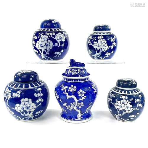 Five Chinese blue and white prunus pattern porcelain jars an...