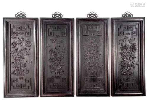 A set of four Chinese rectangular carved wood panels, late 1...