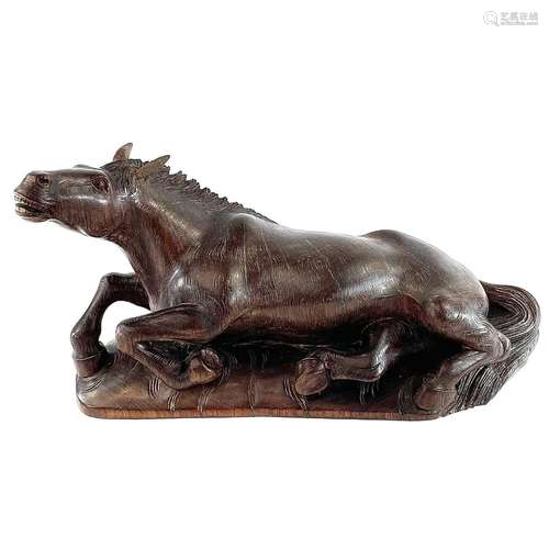 A Chinese carved wood model of a horse, 19th century, on a l...