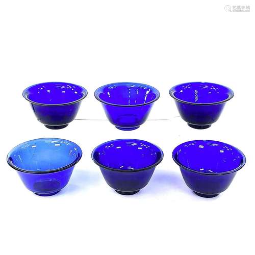 Six Peking blue glass bowls, largest height 6cm, diameter 10...