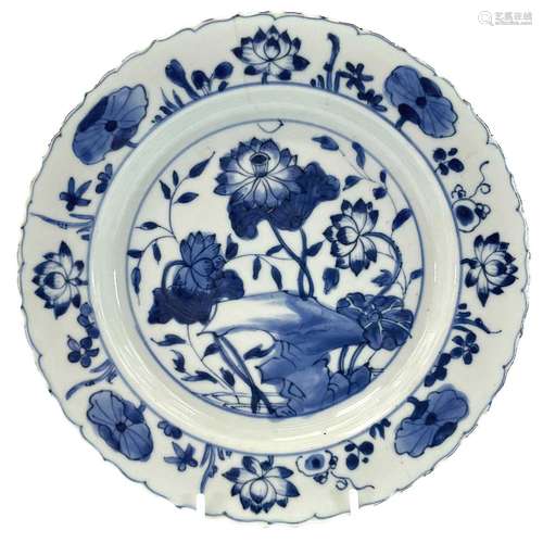 A Chinese blue and white plate, Ming Dynasty, decorated with...