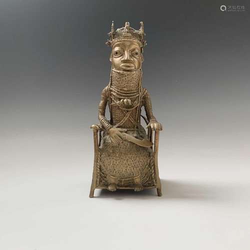 A Benin bronze model of a seated chief, height 28.5cm, width...