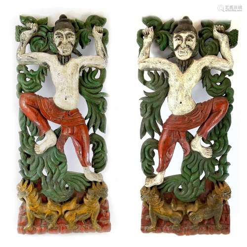 A pair of Chinese painted carved wood panels, early-mid 20th...