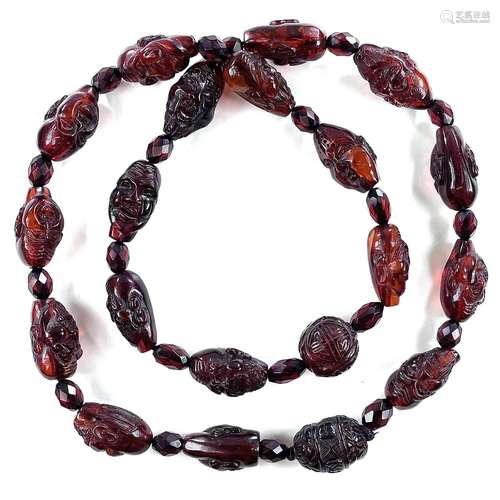 A Chinese cherry amber bakelite bead necklace, signed, 78 gr...