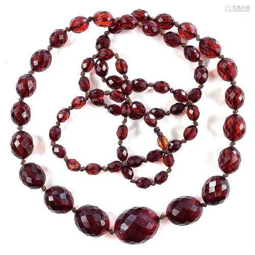 A cherry amber bakelite graduated bead necklace, length 104c...