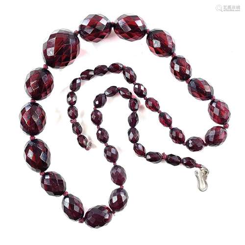 A cherry amber bakelite graduated bead necklace, length 62cm...