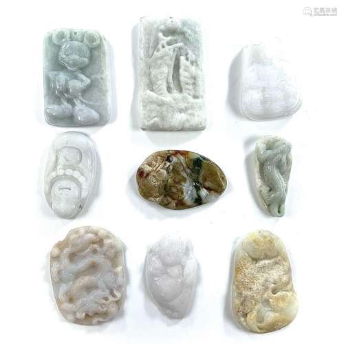 A collection of jade and hardstone carvings and pendants, la...