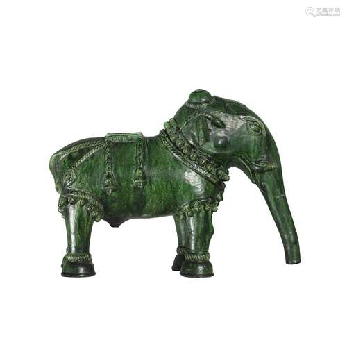 An Ottoman green glazed model of a caparisoned elephant, 19t...